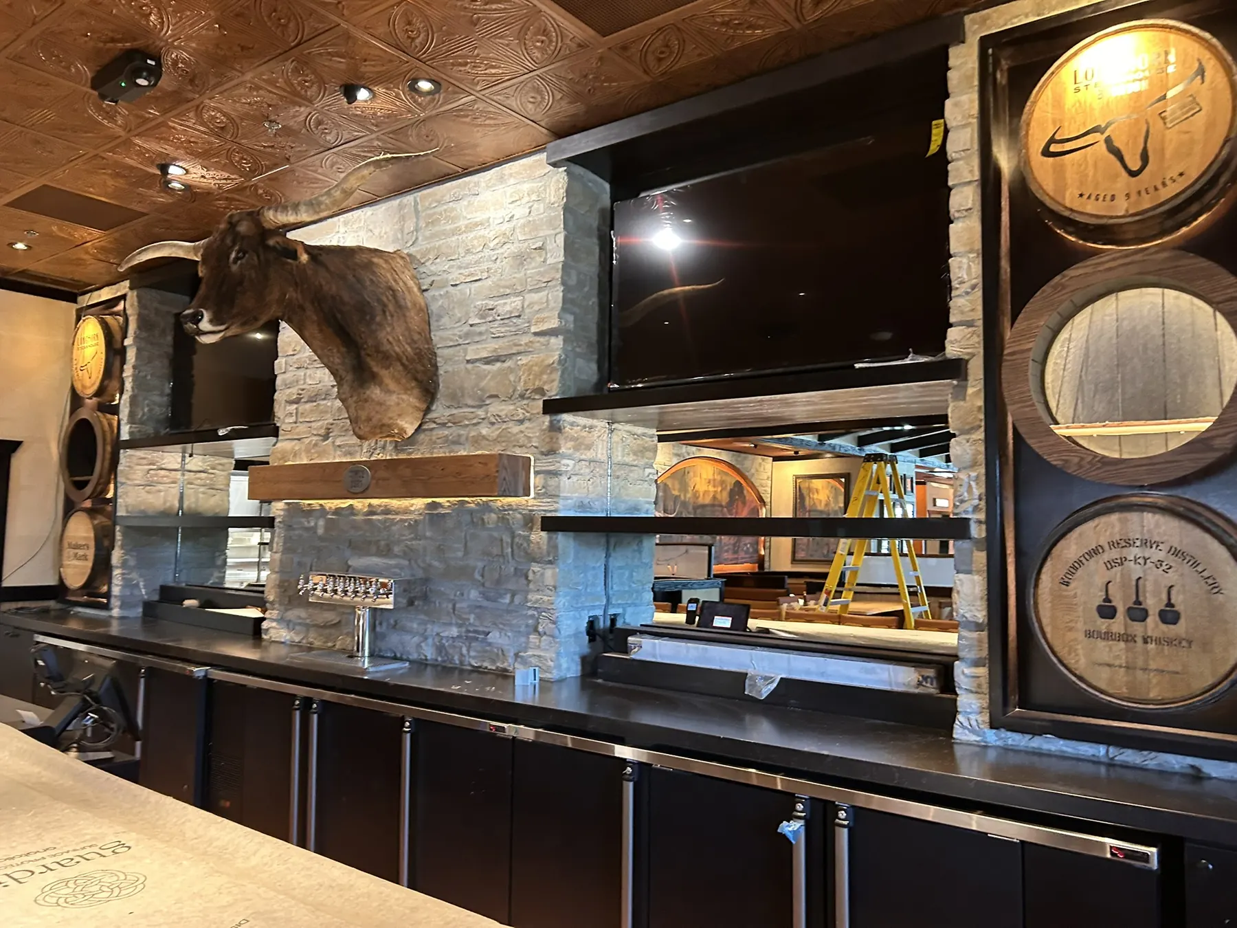 Stacked stone bar surround inside a LongHorn Steakhouse under construction